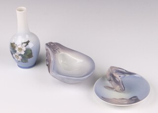 A Royal Copenhagen vase decorated with raspberries 28873.5 15cm, a dish in the form of an oyster shell 4553 13cm and an ashtray decorated fish 931 11cm 