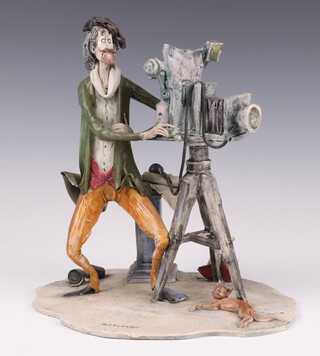 A Lo Scricciolo mid-century studio ceramic figure of a photographer with cat signed A Colombo 22cm 