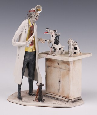 Lo Scricciolo mid-century studio ceramic figure group of a vet with dog and kitten signed Belle Duso 17cm 