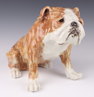 A Jenny Winstanley ceramic figure of a seated British Bulldog with glass eyes, painted signature to base 26cm 