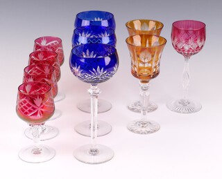 Four Bohemian red glass wine glasses 13cm, a pair of orange ditto 18cm, 3 blue hock glasses 20cm and 1 red hock 18cm 