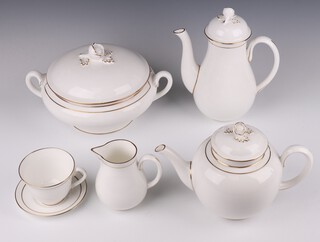 An extensive Royal Worcester Contessa pattern tea, coffee and dinner service, comprising 8 coffee cans, 8 saucers, 8 tea cups, 8 saucers (1 a second), 8 small plates, 12 medium plates, 2 serving platters, milk jug, 2 cream jugs, 8 dessert bowls, 8 soup bowls, 4 tureens and covers, 11 dinner plates, sauce boat and stand, cake platter, oval vegetable dish, sugar bowl and lid, bowl, cake server, 2 teapots and lids, 2 coffee pots and lids 