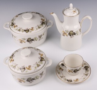 A Royal Doulton Larchmont pattern tea, coffee and dinner service, comprising 8 coffee cans, 8 saucers, 8 tea cups, 8 saucers, 8 two handled bowls, a coffee pot and cover, 3 casseroles with covers - small, medium and large, 2 tureens and covers, an oval meat plate, sauce boat and stand, cream jug, ramekin and bowl, 8 dessert bowls, 8 small plates, 8 medium plates, 8 dinner plates