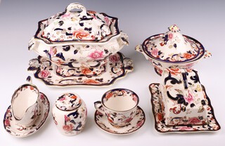An extensive Masons Mandalay tea and dinner service comprising 8 small tea cups, 8 saucers, 4 large tea cups, 4 saucers, 2 oval meat plates, tureen, cover, stand and ladle, pair of circular ditto, cheese dish and stand, 2 sauce boats and 2 stands, 4 egg cups, 2 vegetable dishes, ginger jar and cover, milk jug, 8 small plates, 8 medium plates, 8 dessert plates, 8 dinner plates, 8 soup bowls 
