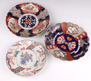 A 19th Century Imari plate decorated with panels of flowers and scalloped rim 24cm, a ditto 27cm and a famille verte plate decorated with exotic birds and flowers 21cm 