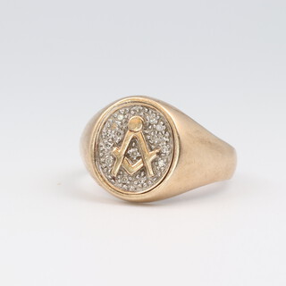 A gentleman's 9ct yellow gold swivel Masonic ring, diamond set and with square and compass, size W, 8.8 grams
