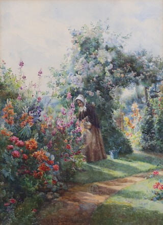 Mary Annie Sloane (British, 1867-1961), A Figure in a Cottage Garden picking Flowers, watercolour, signed and dated 1892, 33cm x 24cm, within a gilt frame.