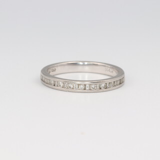 A platinum wedding band set with brilliant cut diamonds approx. 0.03ct, size M, 3.4 grams