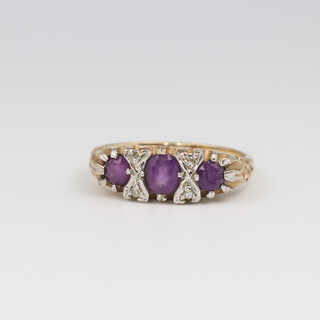 A 9ct yellow gold amethyst and diamond ring size L 1/2, the diamonds approx 0.3ct, the amethysts approx. 0.75ct, size L 1/2, 3.1 grams 
