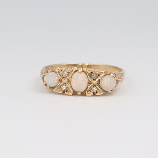 A 9ct yellow gold opal and diamond ring, the 3 opals approx. 0.5ct, the 4 diamonds approx. 0.04ct, size P 1/2, 3.6 grams 