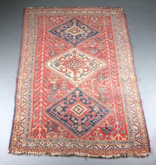 A brown, green and blue ground Caucasian style rug with 3 diamond medallions to the centre within a multi row border 231cm x 141cm 