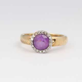 A 9ct yellow gold amethyst and diamond cluster ring, the centre amethyst 1.0ct, the brilliant cut diamonds 0.2ct, size P, 4.2 grams 