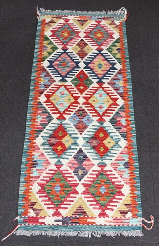 A white, blue and brown ground Chobi Kilim runner with all over diamond designs 153cm x 62cm
