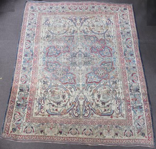 A blue and white ground North Persian carpet, the central medallion decorated with animal masks, lions savaging a bull, wild boar, all within a floral multi row border, 329cm x 263cm 