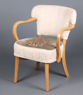 A 1950's walnut show frame open arm chair upholstered in green and floral patterned material 73cm h x 58cm w 