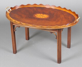 A Georgian style oval inlaid mahogany twin handled tea/butler's tray, raised on a stand, 46cm h x 87cm w x 55cm d