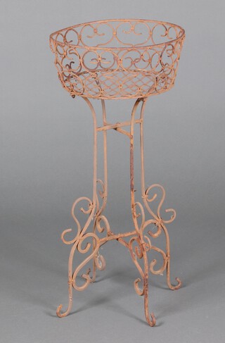 A circular pierced metal wire work garden planter 74cm h x 33cm diam. 