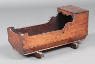 A child's 19th Century miniature rocking cradle 25cm h x 53cm w x 21cm d 