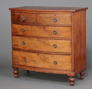 A 19th Century mahogany bow front chest of 2 short and 3 long drawers, raised on turned supports 100cm h x 101cm w x 49cm d (veneers missing in places) 