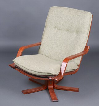 A mid-century teak framed open arm revolving chair 86cm h 
