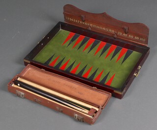 A Backgammon board together with a snooker cue dated 1929, the case marked G Wise Parker 1929 and a snooker scoreboard 