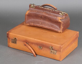 A Gladstone bag and a leather suitcase