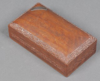 A rectangular carved Burmese hardwood cigarette box with hinged lid and plaque marked HMS Pinafore September 1937 6cm x 20cm x 12cm