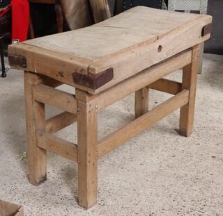 A butcher's block raised on an associated pine stand 90cm h x 120cm w x 61cm d 
