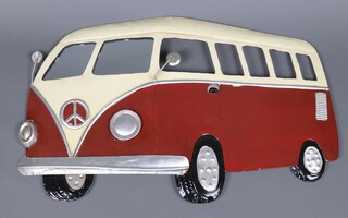 A red and white pressed metal wall plaque in the form of a VW Camper Van with mirrored windscreen 48cm x 58cm  