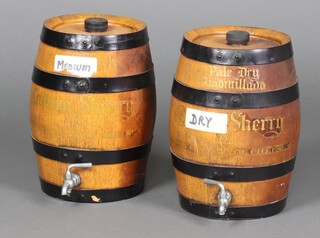 A pair of Cadoza sherry casks with spigots 34cm x 20cm 