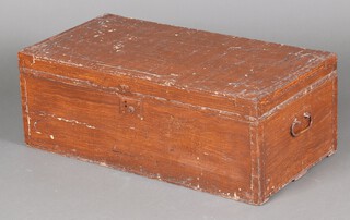 A 19th Century brown painted pine trunk with hinged lid and iron drop handles 31cm h x 90cm w x 46cm d 