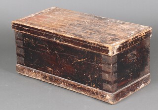 A 19th Century pine trunk with hinged lid and iron drop handles to the sides 40cm h x 90cm w x 44cm d 