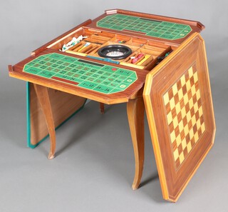 An octagonal inlaid games table, the lid with chessboard revealing a fitted a roulette wheel and counters, raised on cabriole supports 74cm h x 76cm w x 77cm d 