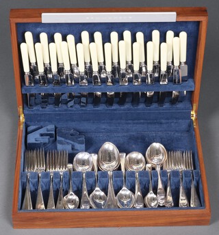 An Old English pattern canteen of cutlery for 12, contained in a walnut effect canteen box 