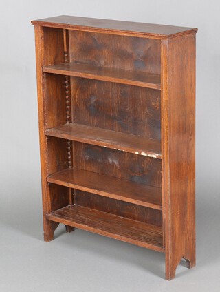 An oak open bookcase fitted adjustable shelves 110cm h x 79cm w x 32cm d