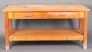 A large pine table/work bench fitted 2 long drawers above slatted undertier 89cm h x 180cm w x 76cm d