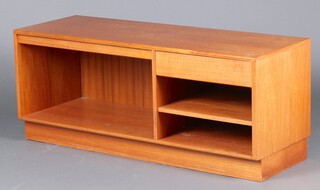 A G-Plan teak cabinet fitted 1 short drawer above shelving, flanked by a recess and raised on platform base 53cm h x 141cm w x 46cm d, together with a G-Plan cupboard enclosed by panelled doors