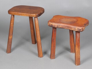 A rustic wooden stool 40cm h x 39cm w x 27cm d together with an oak ditto 46cm h x 35cm w x 25cm d, both raised on tripod supports