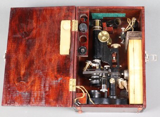 A Bausch & Lomb "Student" microscope with rack and pinion focusing, contained in a fitted case