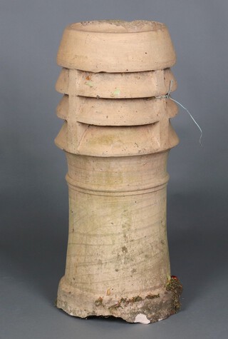 A circular terracotta louvred chimney pot 80cm h x 33cm d