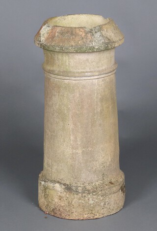 A circular terracotta chimney pot 72cm h x 35cm d