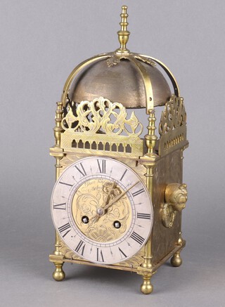 A reproduction brass lantern clock with quartz movement. 30cm h