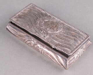 A rectangular cushion shaped silver box with repousse decoration (a/f) 3.5cm h x 12cm w x 7cm d