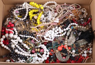 A collection of faux pearl necklaces and other costume jewellery