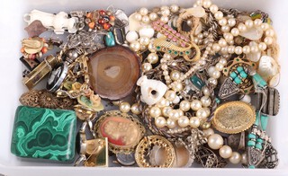 A small malachite trinket box and a quantity of Victorian and later costume jewellery, a mother of pearl handled paper knife and magnifying glass etc 