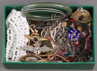 A quantity of costume jewellery including a horn pendant, hardstone bangle, RAF badges, watches etc