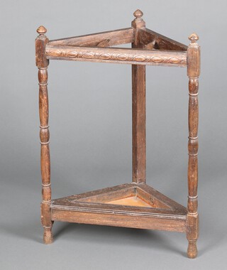 A 1930's oak corner umbrella stand complete with drip tray 74cm x 53cm x 39cm 