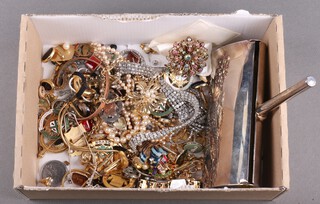 A quantity of various costume jewellery mainly brooches, fobs and badges, minor coins, etc, and a table sweeper