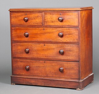 A Victorian mahogany D shaped chest of 2 short and 3 long drawers with turned handles, raised on a platform base 104cm h x 103cm w x 52cm d (section of veneer missing between the 2 short drawers) 