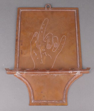 A copper hanging pipe rack decorated a hand to the back board 